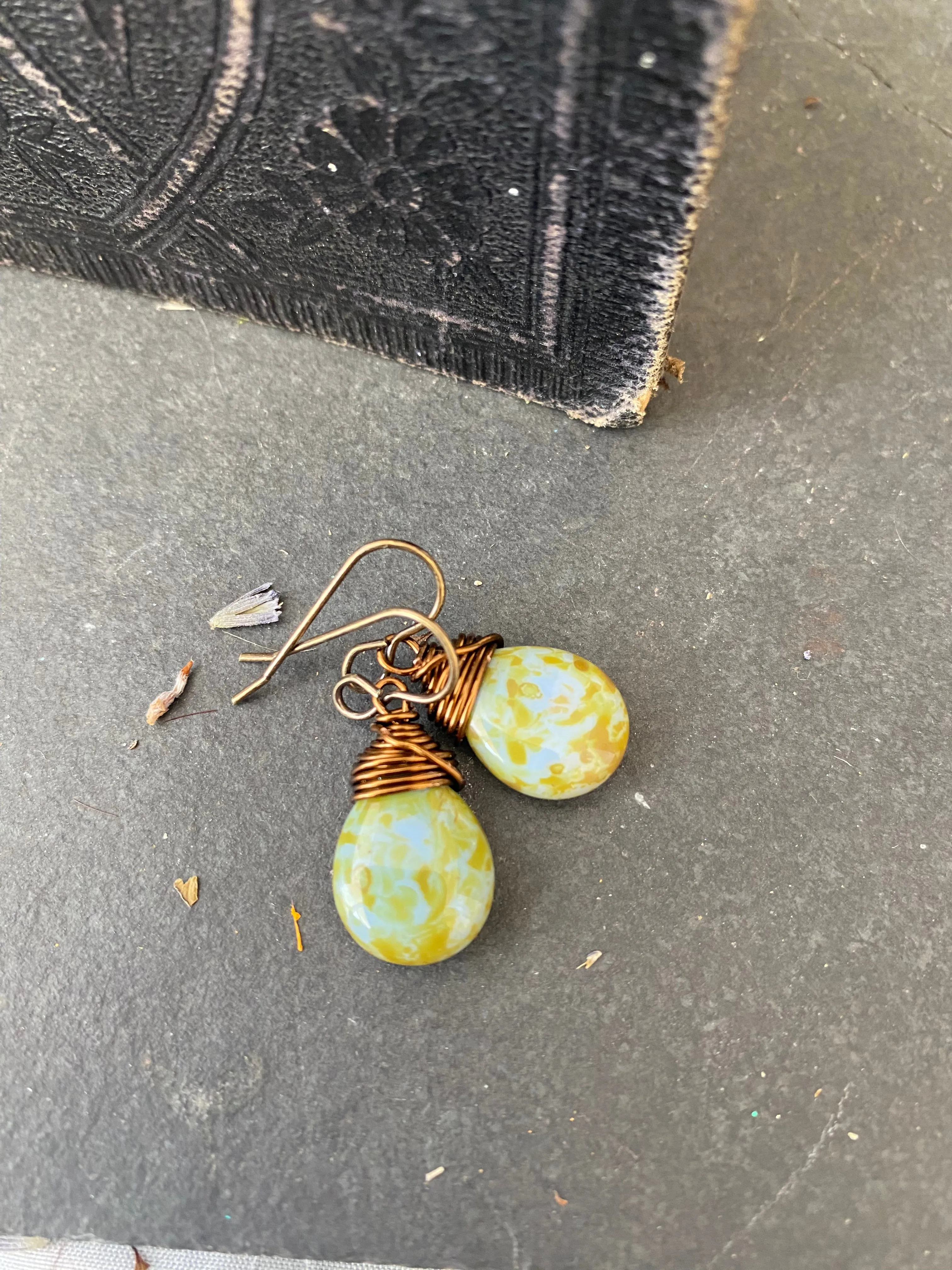 Teardrop glass in blue and green and bronze wire wrapped earrings.