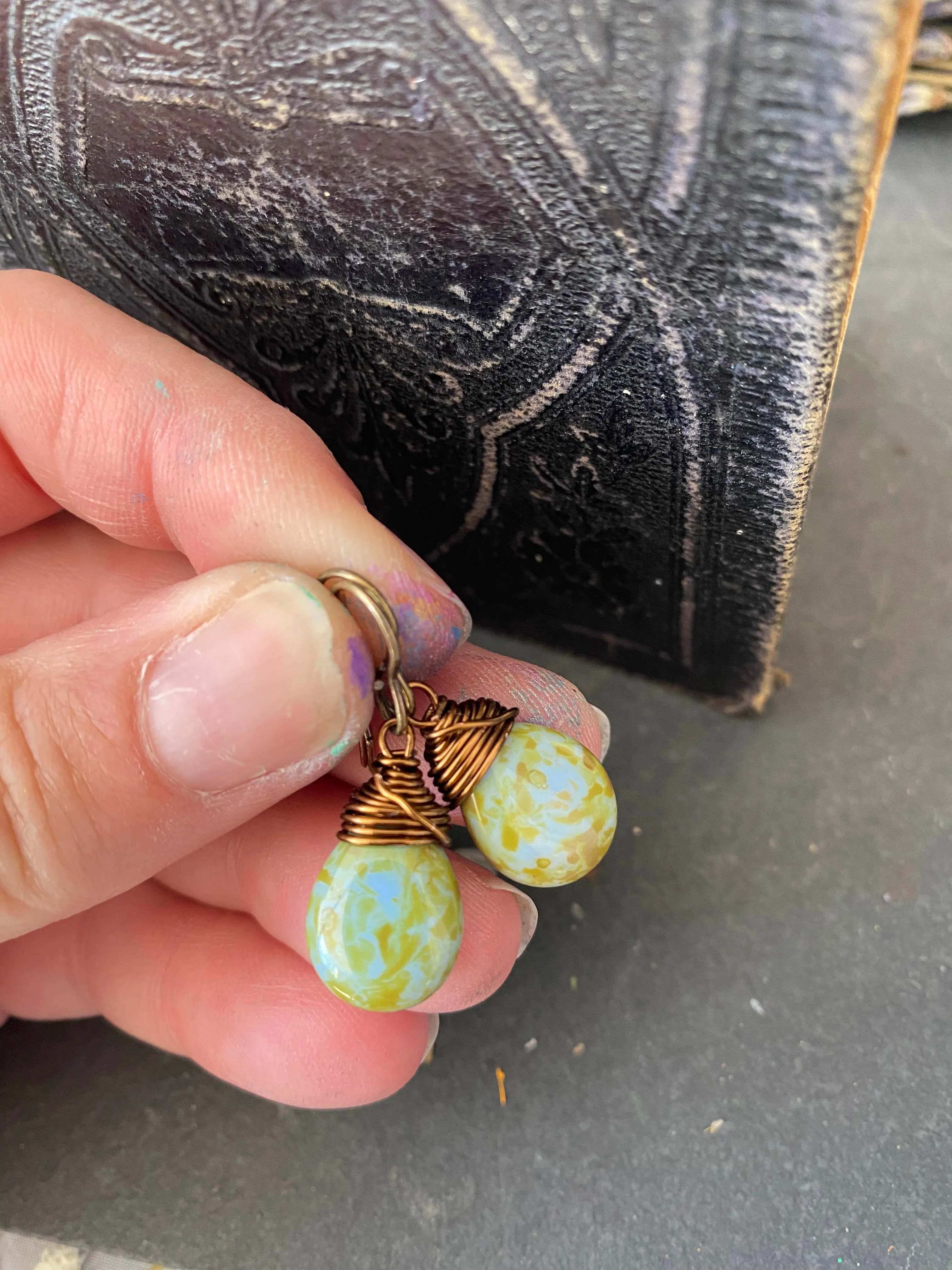 Teardrop glass in blue and green and bronze wire wrapped earrings.