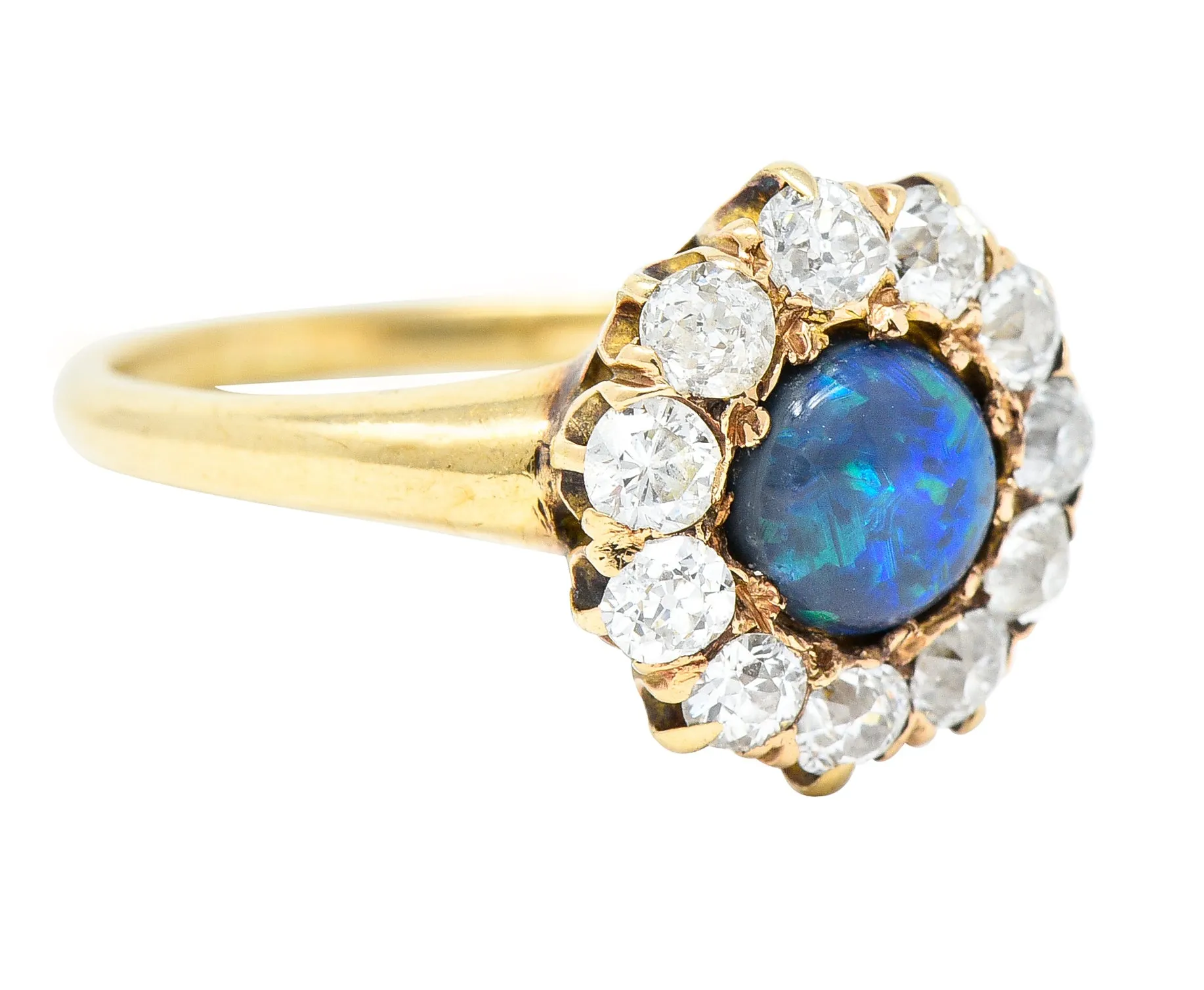 Victorian 0.88 CTW Black Opal Cabochon Old European Cut Diamond 14 Karat Yellow Gold Antique Halo Ring