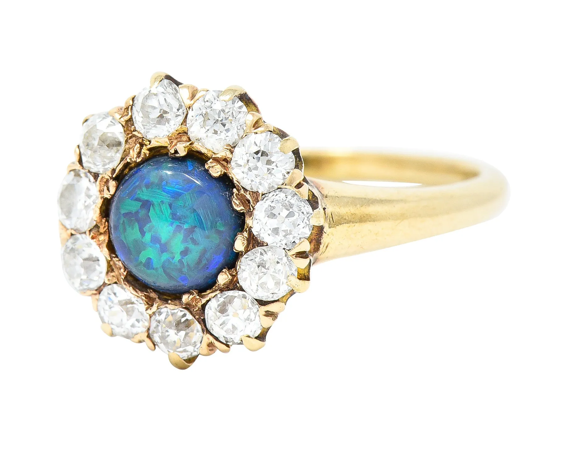 Victorian 0.88 CTW Black Opal Cabochon Old European Cut Diamond 14 Karat Yellow Gold Antique Halo Ring